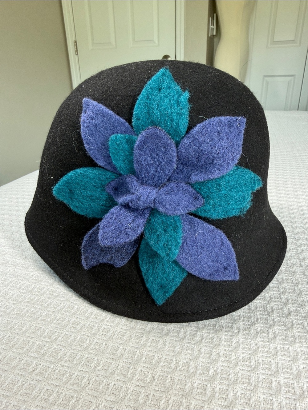 Alessandra Bacci wool hat with teal and blue/purple floral embellishment NWT